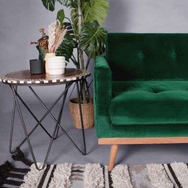 green velvet sofa boho side table