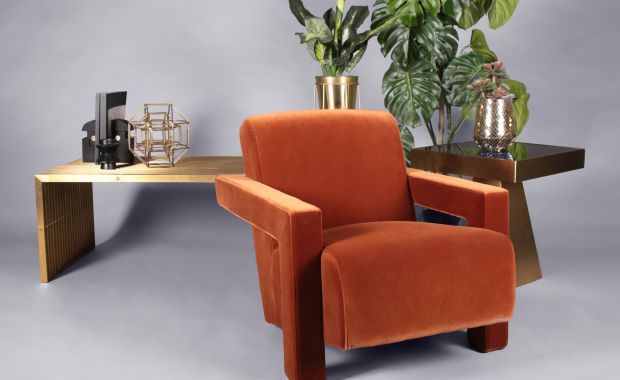 orange velvet armchair and gold finished side tables