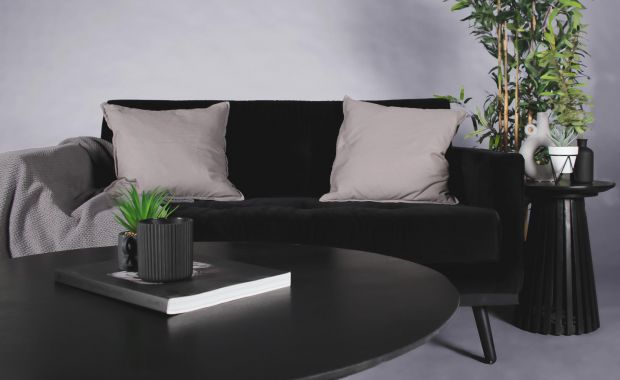 black velvet sofa with black coffee table and side table 