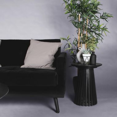 black velvet sofa with black coffee table and side table 