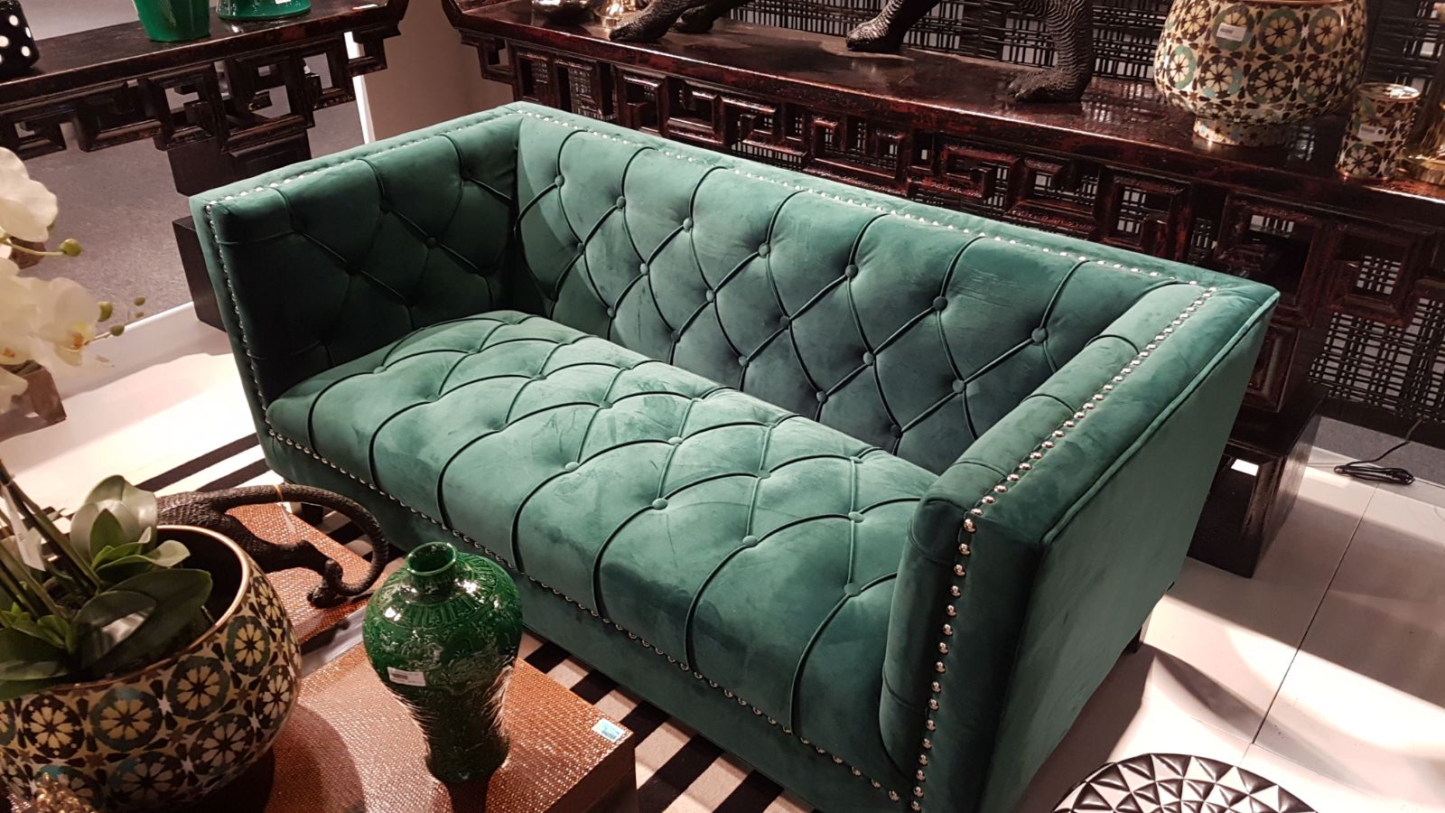 image of a luxurious dark velvet chesterfield sofa