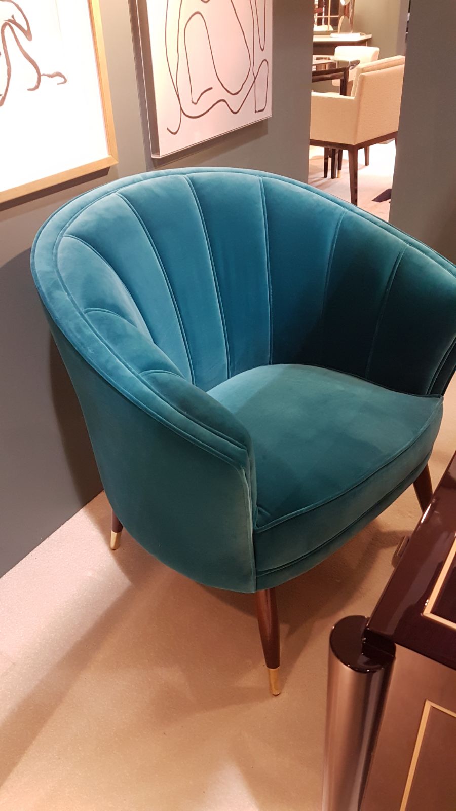 image of a teal velvet armchair