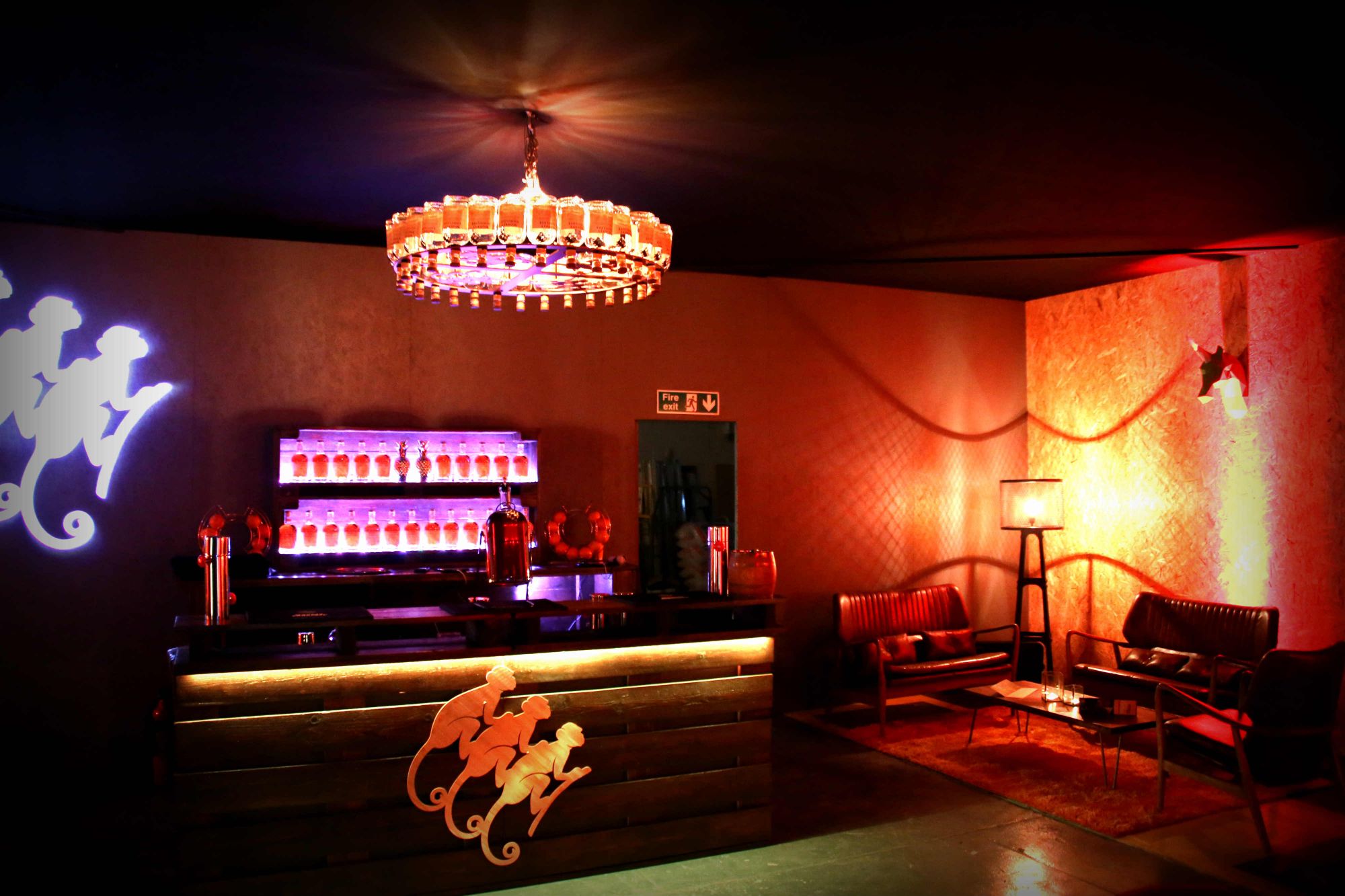 Indulgent furniture was provided by Furniture on the move as seen in this image which contains the monkey shoulder logo light up by LED next to a bar filled with monkey shoulder whisky