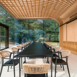 Premium Event Table hire inside the glass pavilion at Rhodes House, Oxford.